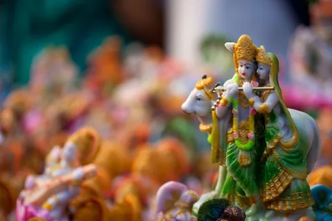 Radha Krishna with Kamadhenu — hand-made golu doll from The Golu Shop